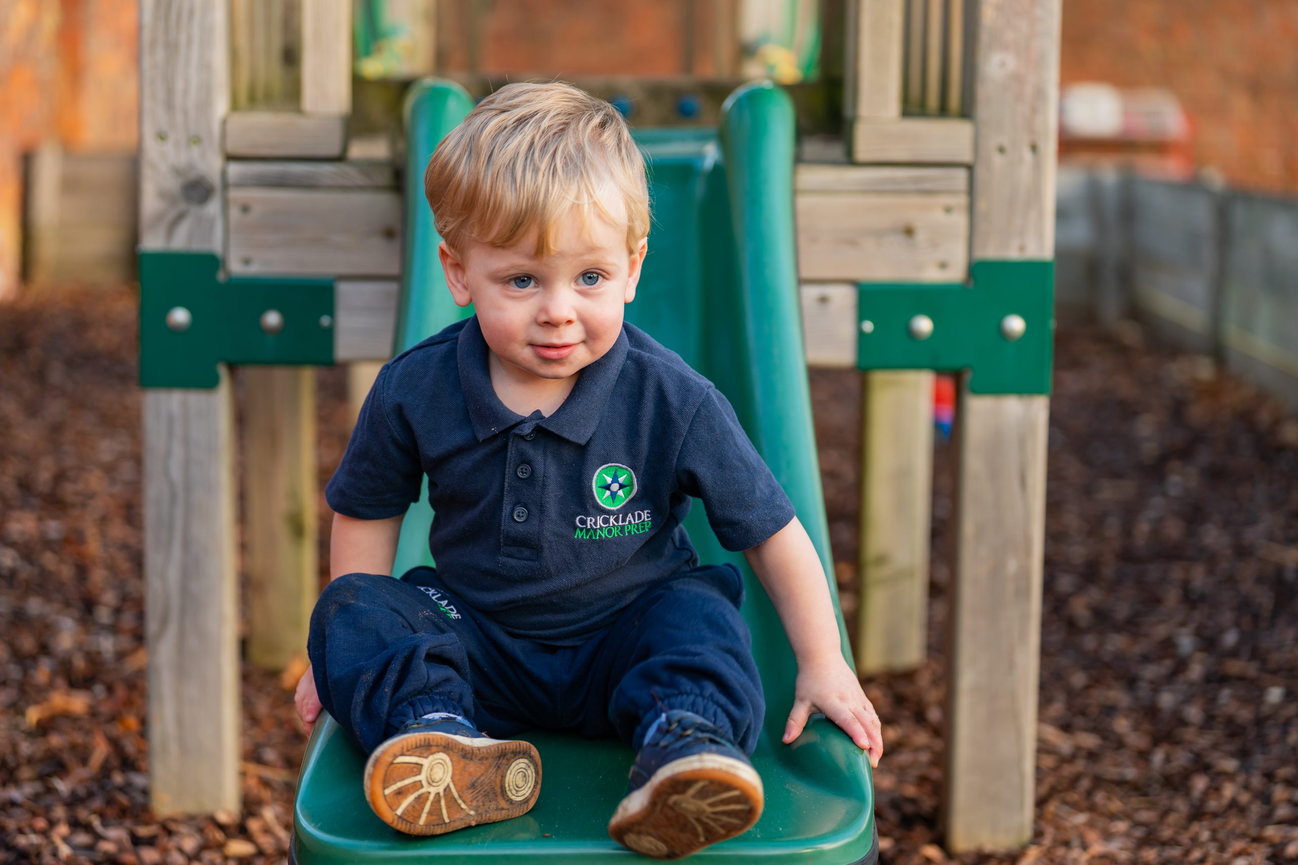 a toddler on a slide